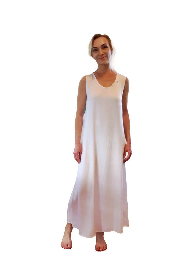 Woman wearing a white sleeveless dress on a white background