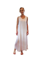 Woman wearing a white sleeveless dress on a white background