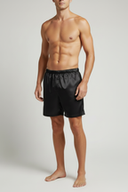 Black silk shorts on male model - hands out