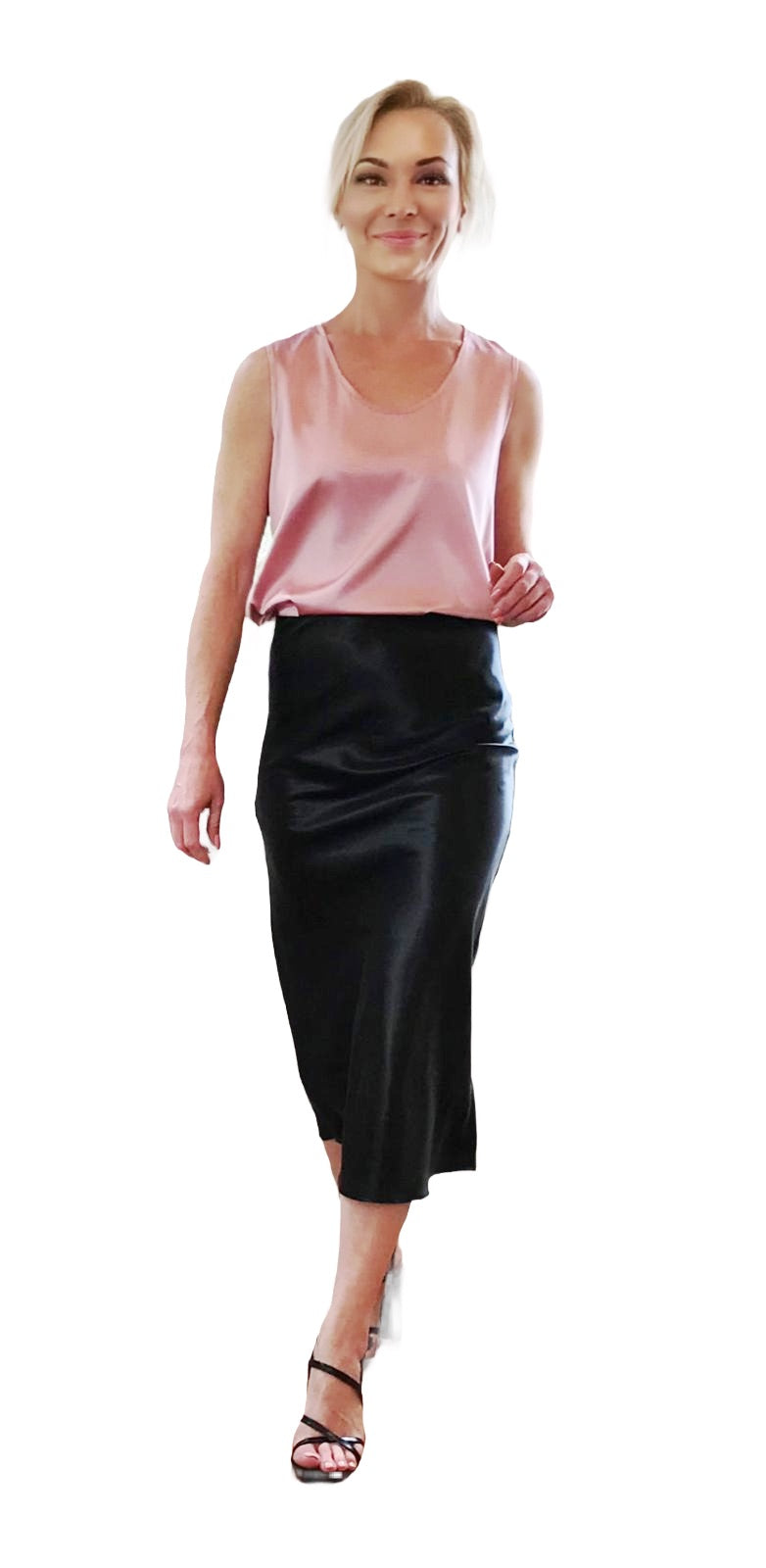 Woman wearing a pink top and black skirt on a white background