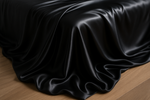 more of flat sheets handing off the bed